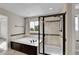Well-appointed bathroom featuring a soaking tub, a separate glass shower, and a window for natural light at 12762 Fisher St, Englewood, CO 80112