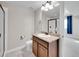 Bathroom featuring granite countertop, modern sink, with a partially obscured toilet and shower at 12762 Fisher St, Englewood, CO 80112