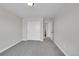 Neutral toned bedroom with a large closet featuring sliding doors and bright natural light at 12762 Fisher St, Englewood, CO 80112