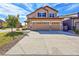 Charming two-story home featuring a three-car garage and a well-maintained front yard at 12762 Fisher St, Englewood, CO 80112
