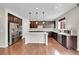 Modern kitchen with stainless steel appliances, granite countertops and an island at 12762 Fisher St, Englewood, CO 80112