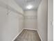 Cozy walk-in closet featuring wire shelving and neutral carpet offering practical storage at 12762 Fisher St, Englewood, CO 80112