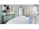 Bedroom with ensuite bathroom access and a neutral color palette at 8600 E Alameda Ave # 13-108, Denver, CO 80247