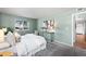 Serene bedroom with light walls, a comfy bed, and access to hallway at 8600 E Alameda Ave # 13-108, Denver, CO 80247