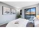 Main bedroom with sliding door to balcony and en-suite bathroom at 8600 E Alameda Ave # 13-108, Denver, CO 80247