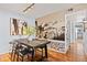 Dining area with a mountain mural and modern dining table at 8600 E Alameda Ave # 13-108, Denver, CO 80247