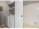 Convenient laundry room with washer, dryer, and extra storage at 8600 E Alameda Ave # 13-108, Denver, CO 80247