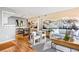 Open living and dining area with mountain mural and hardwood floors at 8600 E Alameda Ave # 13-108, Denver, CO 80247