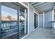 Private patio with sliding door access and a view of the parking lot at 8600 E Alameda Ave # 13-108, Denver, CO 80247