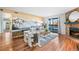 Spacious living room with fireplace, mountain mural and sliding glass doors at 8600 E Alameda Ave # 13-108, Denver, CO 80247