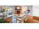 Inviting living room with a stone fireplace, wood floors, and bright natural light at 8600 E Alameda Ave # 13-108, Denver, CO 80247