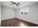 Unfurnished bedroom with dark wood floors and a ceiling fan at 2113 Coronado Pkwy # B, Denver, CO 80229