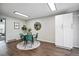 Charming dining area featuring a round table with green chairs, a mirror and a storage cabinet at 2113 Coronado Pkwy # B, Denver, CO 80229