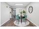 Cozy dining room features modern table with green chairs, stylish decor, and natural light at 2113 Coronado Pkwy # B, Denver, CO 80229