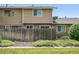 Back exterior view of house showing fence at 2113 Coronado Pkwy # B, Denver, CO 80229