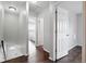 Hallway with hardwood floors leading to multiple rooms in the home at 2113 Coronado Pkwy # B, Denver, CO 80229