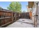 Private patio with wooden fence, offering an outdoor living space at 2113 Coronado Pkwy # B, Denver, CO 80229