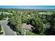 Beautiful aerial view of the property, showcasing mature trees and neighborhood at 10601 E Crestline Ave, Englewood, CO 80111