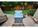 Aerial view of a backyard with artificial turf, a wooden fence, and a hot tub at 10601 E Crestline Ave, Englewood, CO 80111