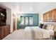 Bright bedroom with a three-window bay, built-in storage, and shutters providing plenty of natural light at 10601 E Crestline Ave, Englewood, CO 80111