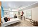 Bright bedroom with ample natural light, white accents, and space-saving built in shelves at 10601 E Crestline Ave, Englewood, CO 80111