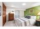 Finished basement bedroom with neutral walls, nice furniture, and an egress window at 10601 E Crestline Ave, Englewood, CO 80111