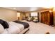 Spacious bedroom featuring neutral colors, large windows, and comfortable sitting area at 10601 E Crestline Ave, Englewood, CO 80111
