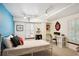 Finished basement bedroom with colorful accent wall, egress window and fun decor at 10601 E Crestline Ave, Englewood, CO 80111