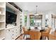 Cozy breakfast nook with hardwood floors, built-in cabinets, and a view of the backyard at 10601 E Crestline Ave, Englewood, CO 80111