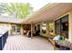 Spacious covered patio with comfortable seating, offering an inviting outdoor living space, complete with stylish decor at 10601 E Crestline Ave, Englewood, CO 80111