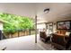 Spacious covered deck with outdoor seating, perfect for entertaining at 10601 E Crestline Ave, Englewood, CO 80111