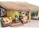 Inviting covered deck with comfortable seating and colorful outdoor rug at 10601 E Crestline Ave, Englewood, CO 80111