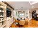 Breakfast nook with hardwood floors, built-in shelving, and lots of natural light at 10601 E Crestline Ave, Englewood, CO 80111