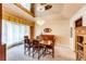 Formal dining room featuring a chandelier, mirrored ceiling, and elegant furnishings for memorable gatherings at 10601 E Crestline Ave, Englewood, CO 80111