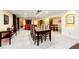 Open basement living space with dining area and cozy seating arrangement at 10601 E Crestline Ave, Englewood, CO 80111