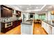 Modern kitchen with stainless steel appliances, island, and breakfast nook at 10601 E Crestline Ave, Englewood, CO 80111