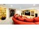 Basement living room features a unique fireplace and bright recessed lighting at 10601 E Crestline Ave, Englewood, CO 80111