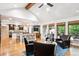 Bright living room offering backyard views, vaulted ceilings, and an open floor plan with an island at 10601 E Crestline Ave, Englewood, CO 80111