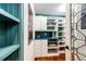 Organized pantry with custom shelving, drawers, and countertop space at 10601 E Crestline Ave, Englewood, CO 80111