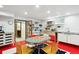 Finished basement recreation room with a retro table and chairs and a kitchenette area at 10601 E Crestline Ave, Englewood, CO 80111