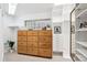 Organized walk-in closet with custom shelving and drawers, offering ample storage space and natural light at 10601 E Crestline Ave, Englewood, CO 80111