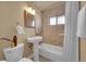 Well-lit bathroom with pedestal sink, and shower-over-tub with neutral accents at 3209 N Olive St, Denver, CO 80207