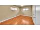 Bright bedroom with hardwood floors and natural light streaming in through the windows at 3209 N Olive St, Denver, CO 80207