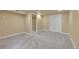 Clean bedroom with neutral walls, plush carpet, and ample closet space at 3209 N Olive St, Denver, CO 80207