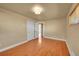 Spacious bedroom with hardwood flooring, ample natural light, and neutral wall color at 3209 N Olive St, Denver, CO 80207