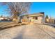 Front view of a remodeled home with new landscaping at 1200 S Wolff St, Denver, CO 80219