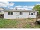 A view of the backyard with a partial fence and windows at 18830 E 16Th Pl, Aurora, CO 80011