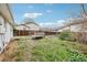 Backyard view of a home with a raised deck area and fence at 18830 E 16Th Pl, Aurora, CO 80011