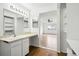 Bright bathroom with a make-up vanity, closet with storage, and view into bedroom at 18830 E 16Th Pl, Aurora, CO 80011
