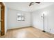 Bedroom features hardwood floors, natural light, and ceiling fan at 18830 E 16Th Pl, Aurora, CO 80011